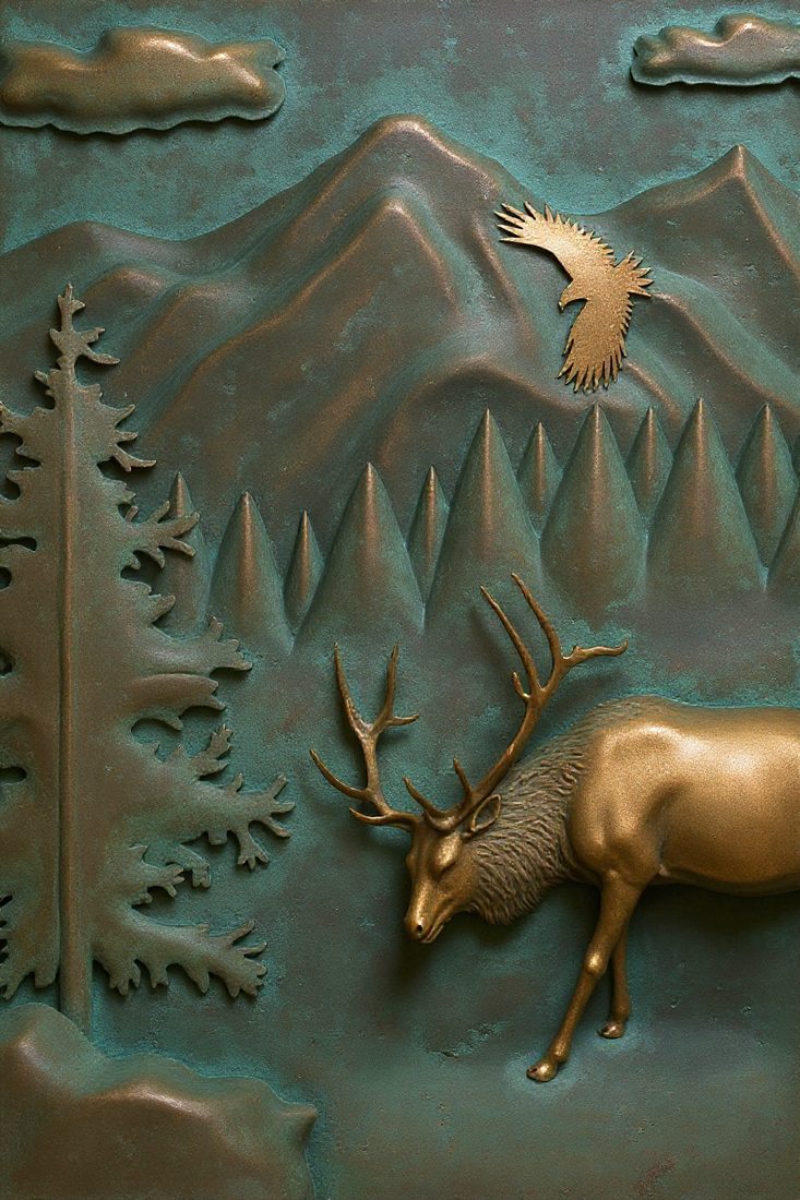 The same relief in a verdigris patina finish